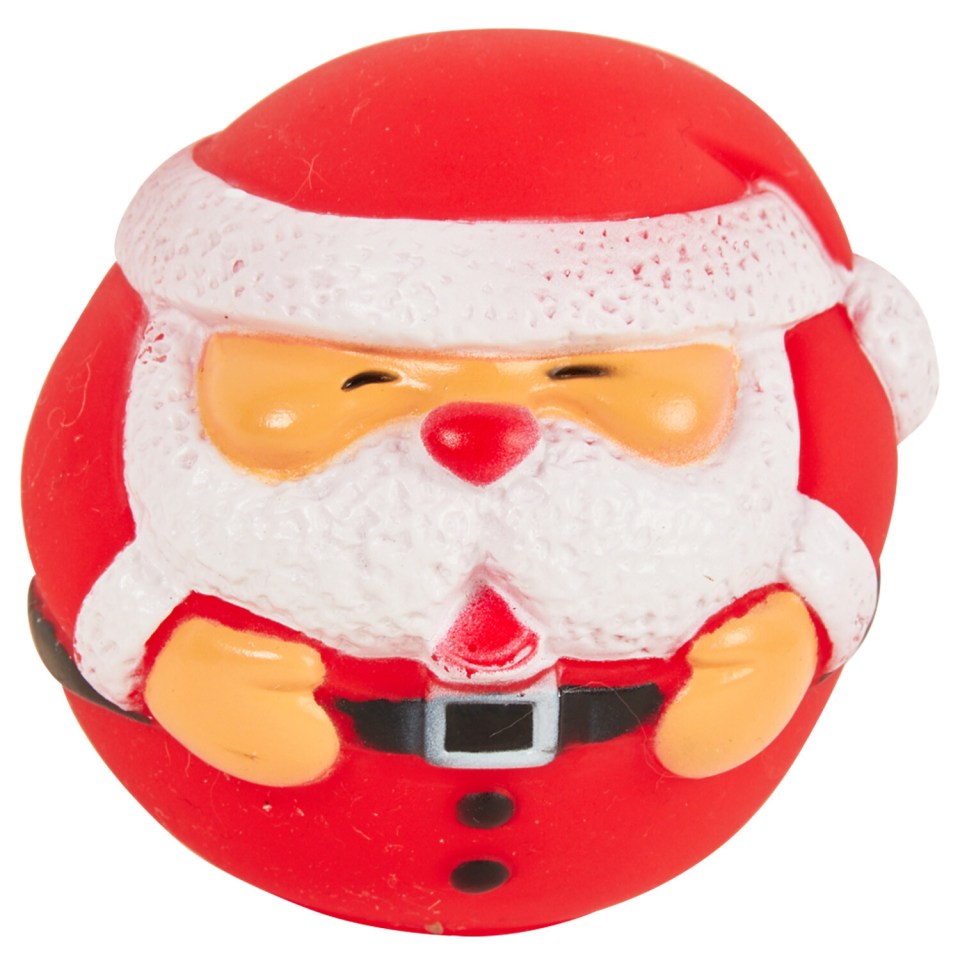 a red and white santa claus figurine with his eyes closed