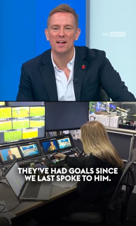 a man in a suit and a woman in a control room are talking about goals