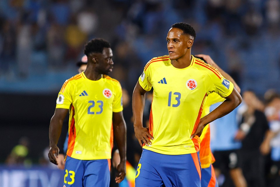 a soccer player wearing a yellow jersey with the number 13 on it