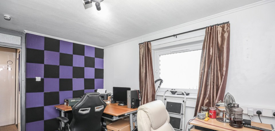 The office space incorporated purple through a chequered accent wall