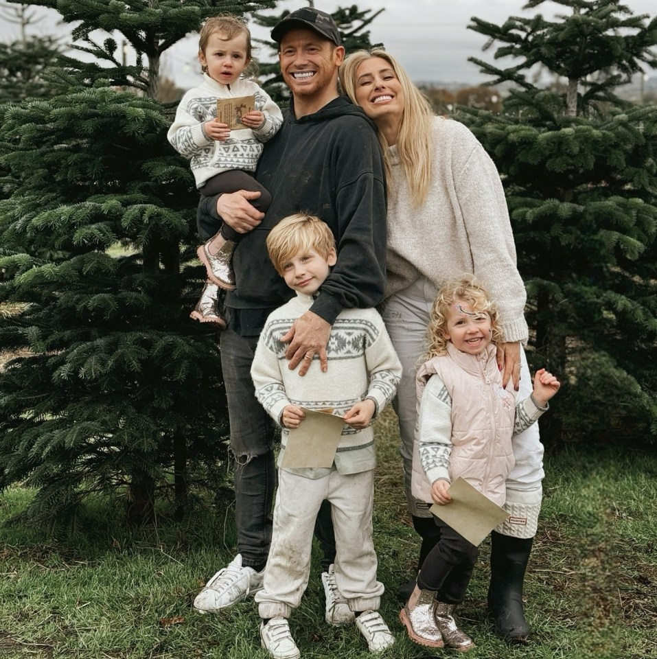 Family choosing a Christmas tree.