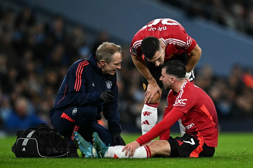 Mason Mount receives medical attention on the field.