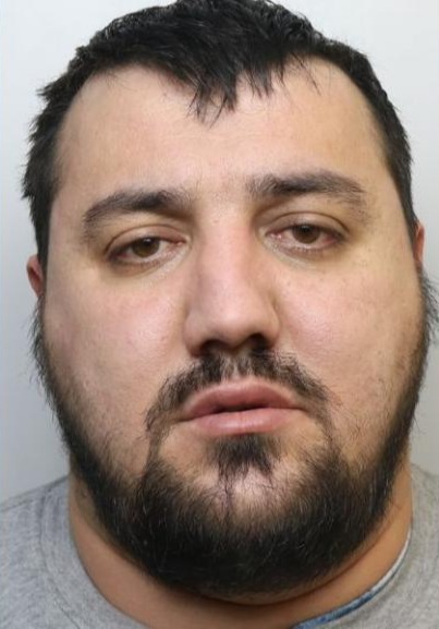 Mugshot of Fatjon Cani, a deported Albanian criminal.