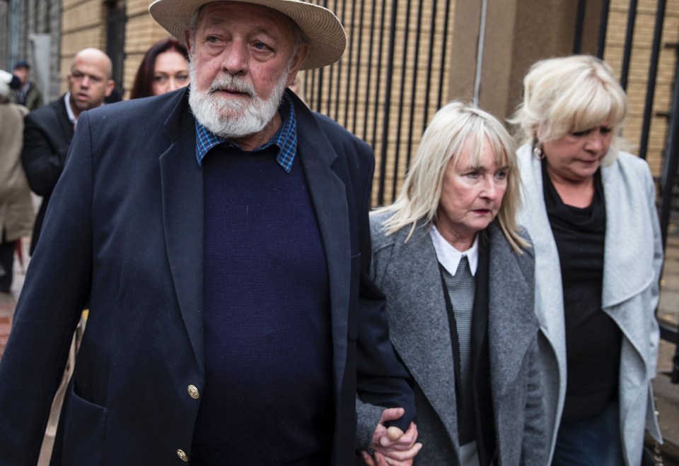 Reeva Steenkamp's father Barry (L) and mother June (C) arrive at the Pretoria High Court on 13 June 2016