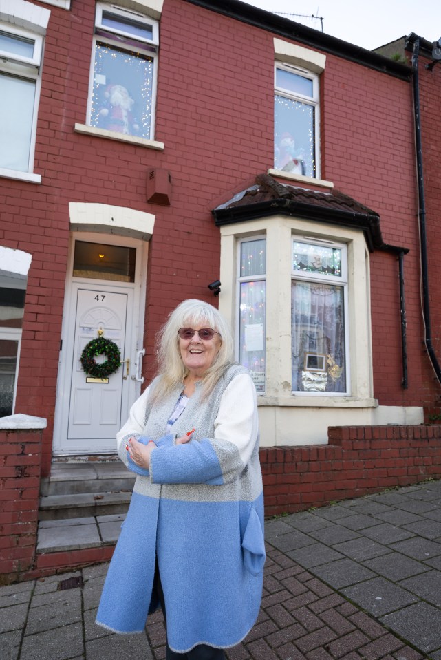 Glenda outside her home on Trinity Street in Barry