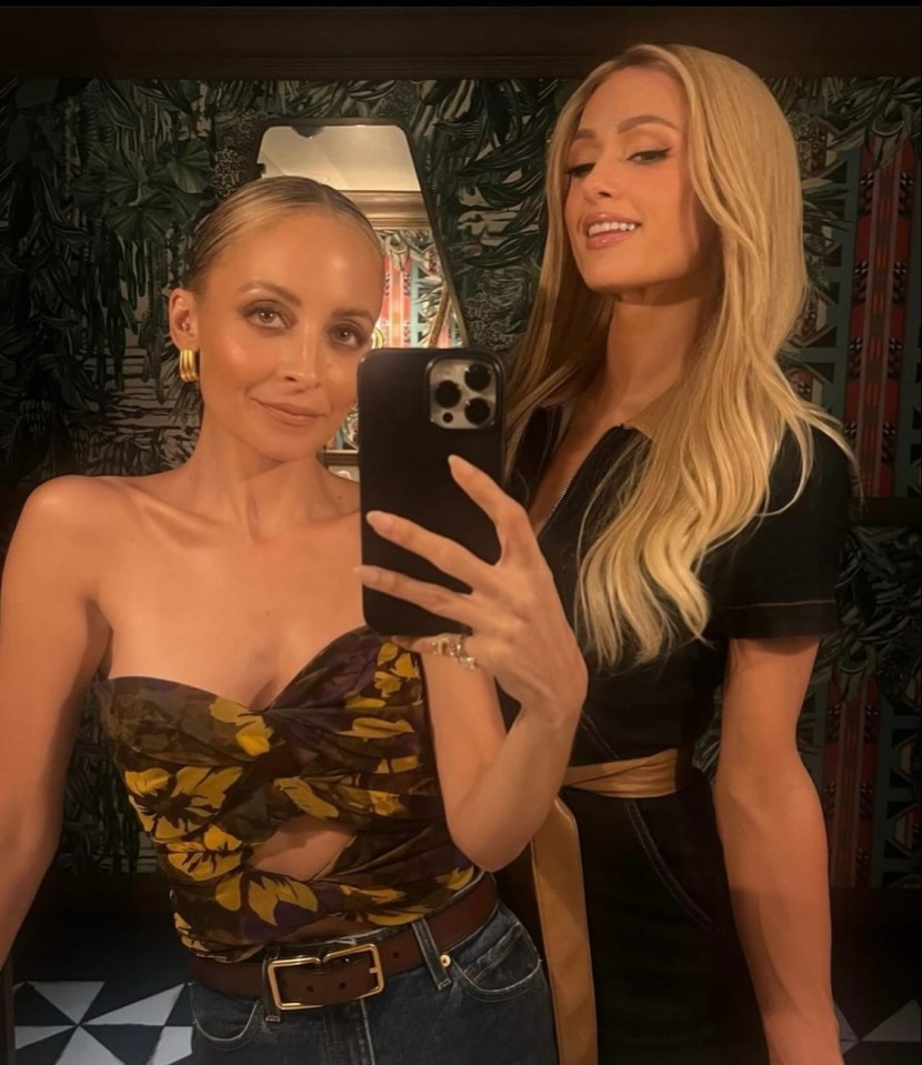 Nicole Richie and Paris Hilton taking a selfie.