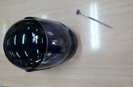 The helmet and awl Kandolaj used to attack his victims