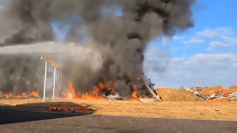 The burning wreckage of a Jeju Air Boeing 737-800 series aircraft