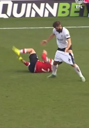 Soccer player's pants pulled down during a fall on the field.