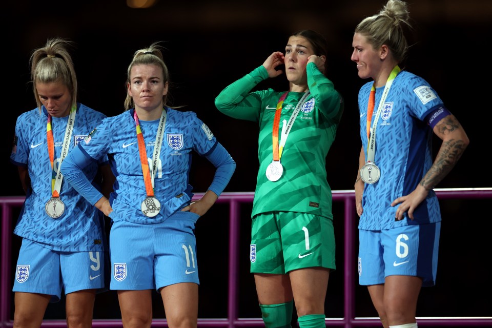 England's women's football team at the World Cup, wearing silver medals.