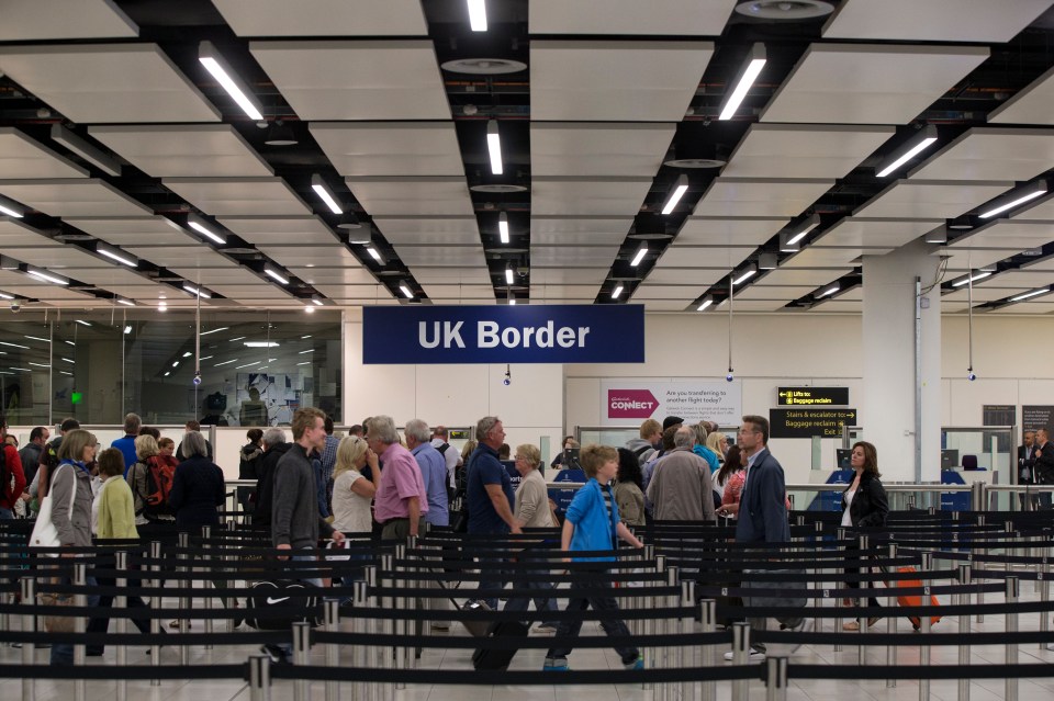 Passengers at UK border control.