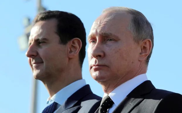 Russian President Vladimir Putin (R) and Syrian President Bashar al-Assad (L) together in 2017