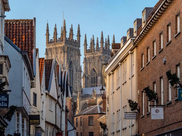 York Minster seen from a narrow street during the Christmas market.