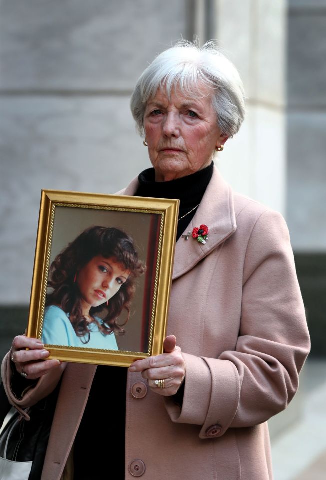 Marie McCourt holding a framed photo of her murdered daughter, Helen McCourt, at a parole hearing.