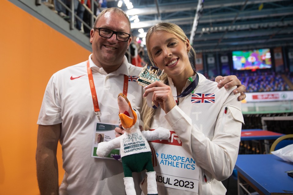 Keely Hodgkinson and her coach celebrating her 800m gold medal win at the European Indoor Championships.