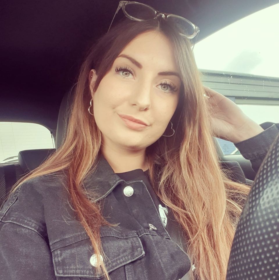 Woman with long hair in a car.