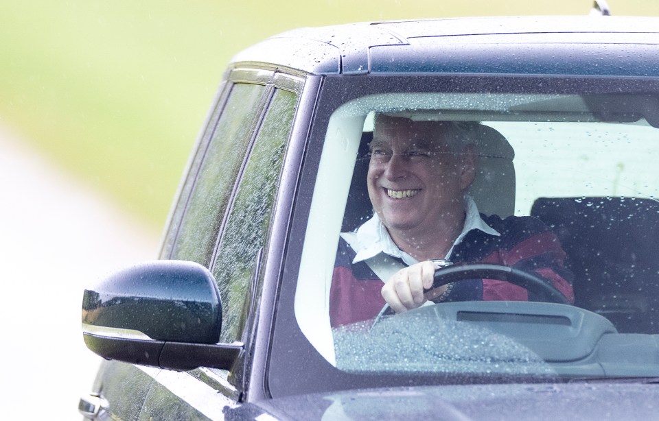 Prince Andrew grins as he leaves Royal Lodge