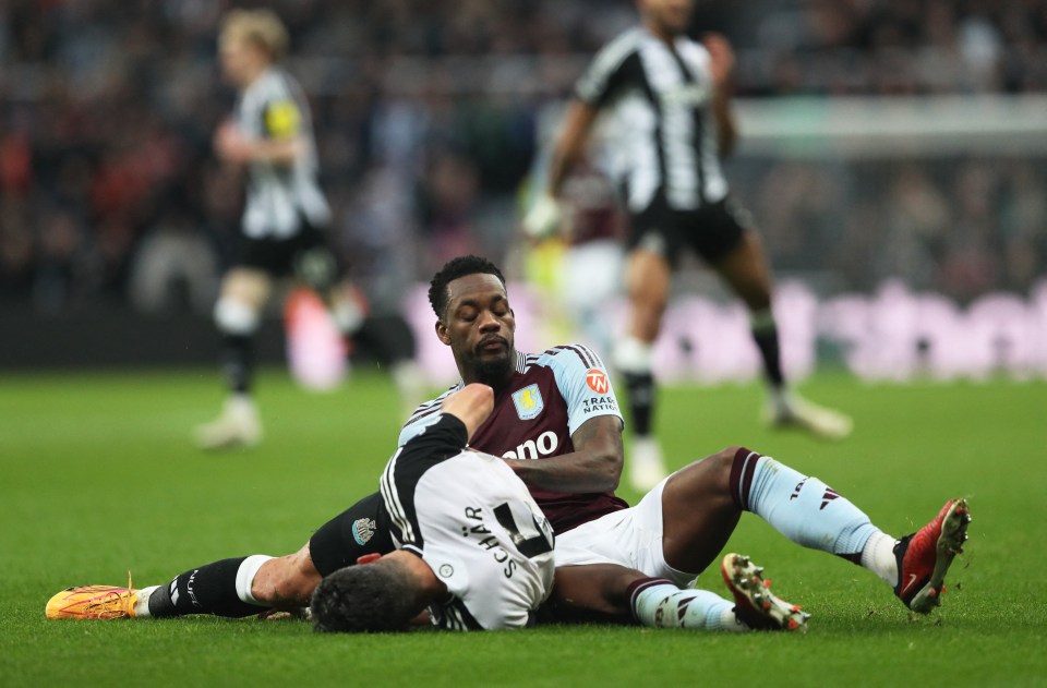 Aston Villa's Jhon Duran fouls Newcastle United's Fabian Schar, resulting in a red card.