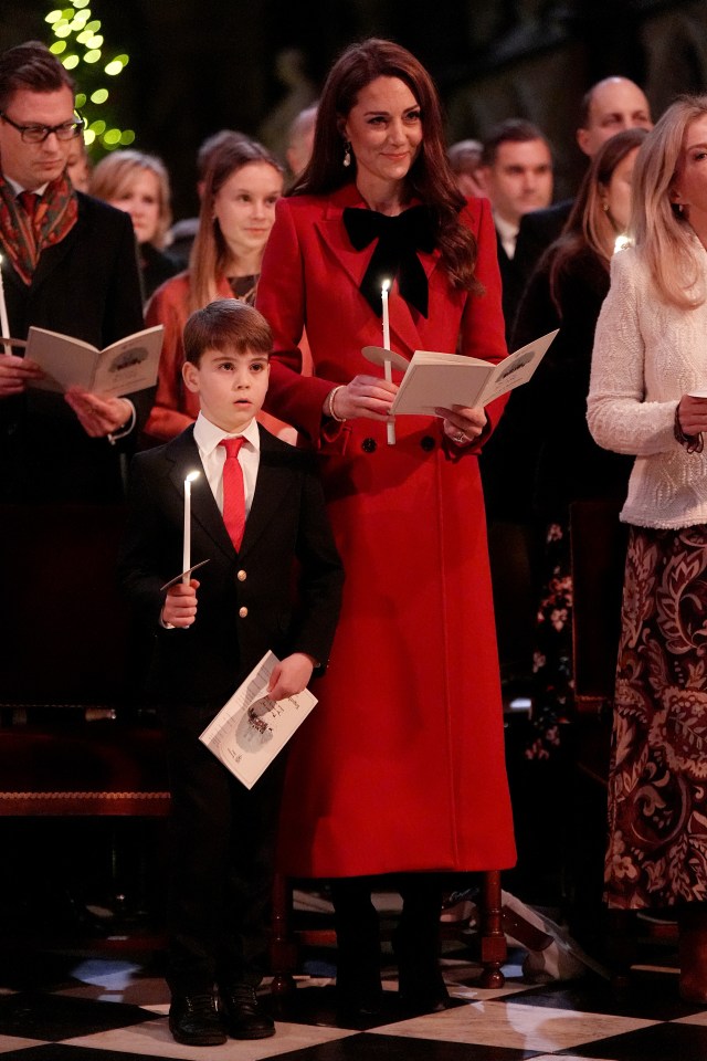 The Princess looked radiant under candle light as she sang festive hymns alongside Louis