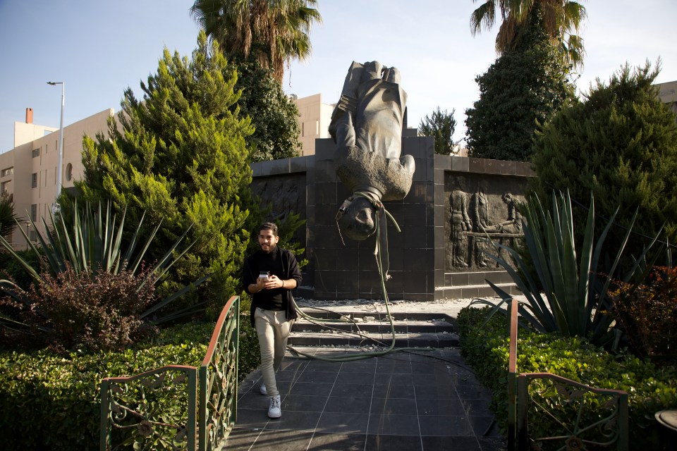 A toppled statue of Hafez al-Assad