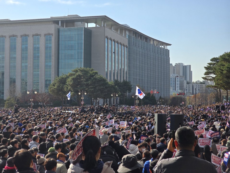 People gathered in front of the parliament on Wednesday to protest the martial law order