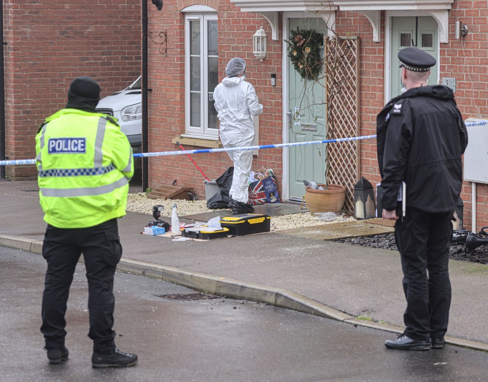 Forensic officers and police at a stabbing crime scene.