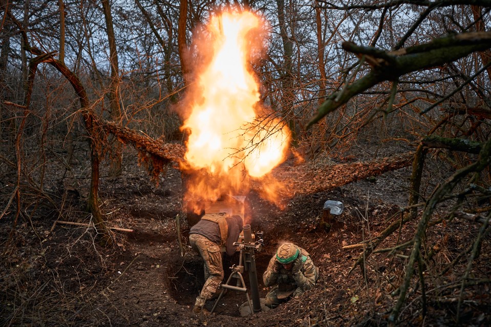 Russian troops firing an 82-mm mortar in Kupiansk, Ukraine.