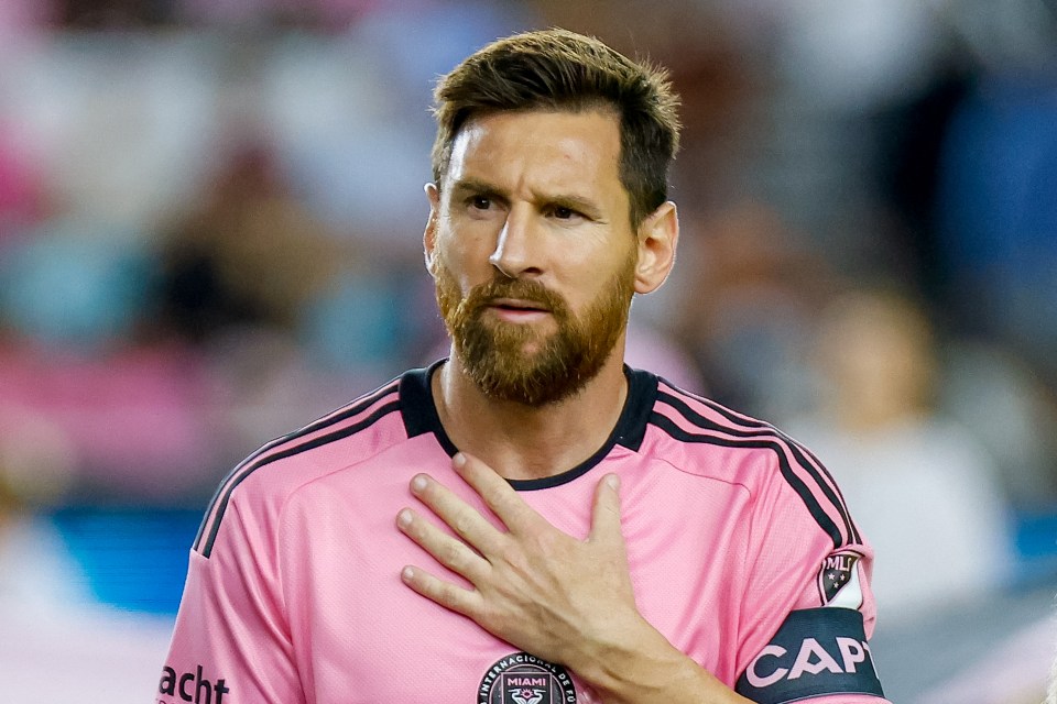 Lionel Messi, in an Inter Miami CF jersey, hand over his heart.