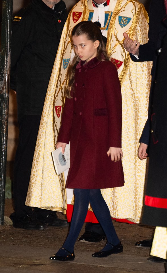 Princess Charlotte gave an adorable stare at Kate's Together at Christmas carol concert on Friday