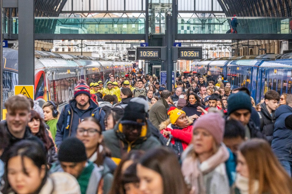 Passengers arriving at London King's Cross station this morning