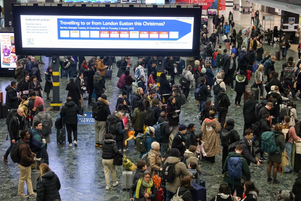 Passengers packing out London Euston station on Christmas Eve