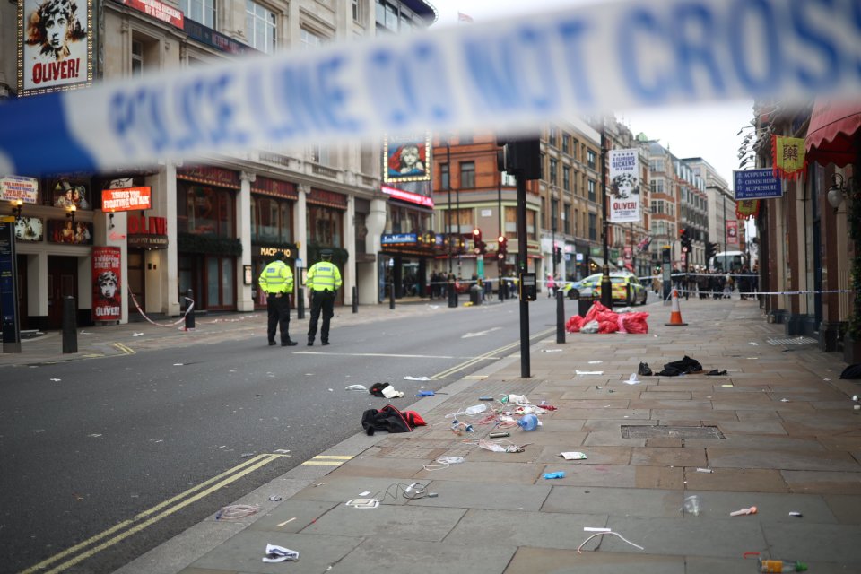 Police guarding a cordon in London after a car hit pedestrians.