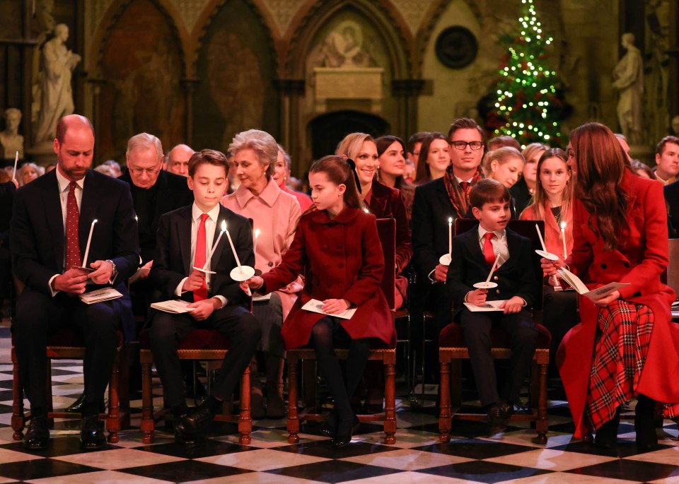 The family lighting their candles as the service begins