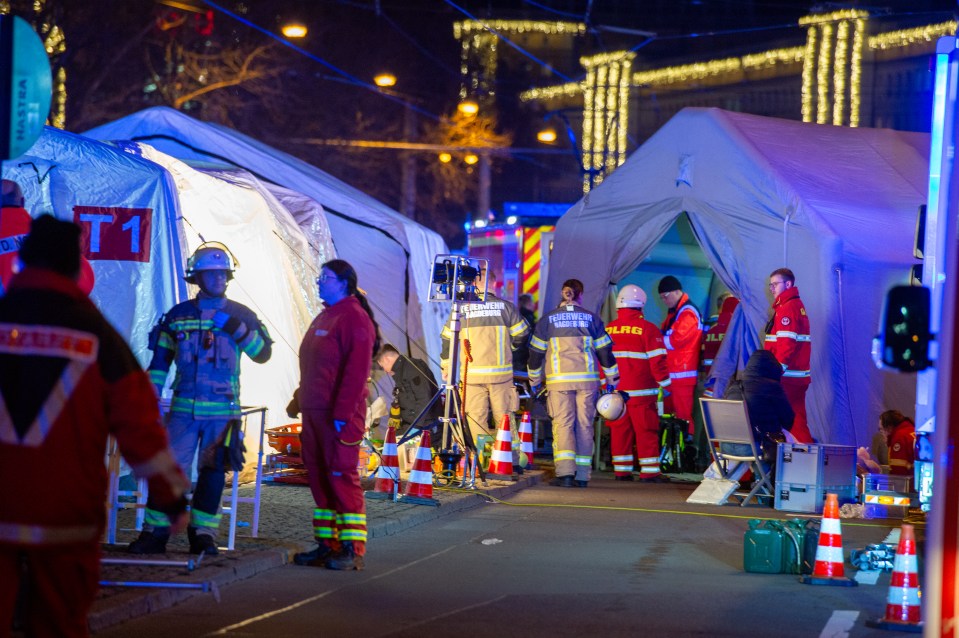 Emergency responders at a Christmas market in Magdeburg, Germany, following a car attack.