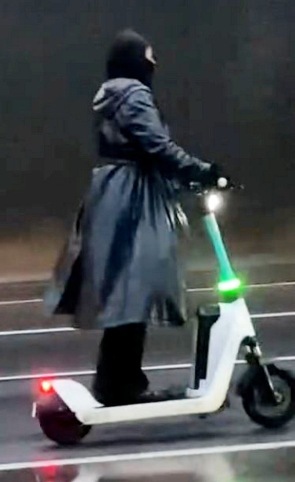 A masked idiot risked their life by riding an e-scooter on a motorway as Storm Darragh raged at the weekend