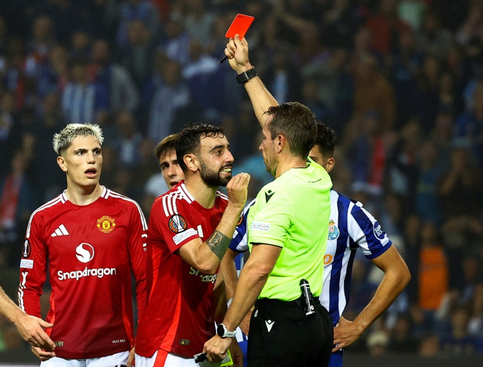 Referee showing Bruno Fernandes a red card.