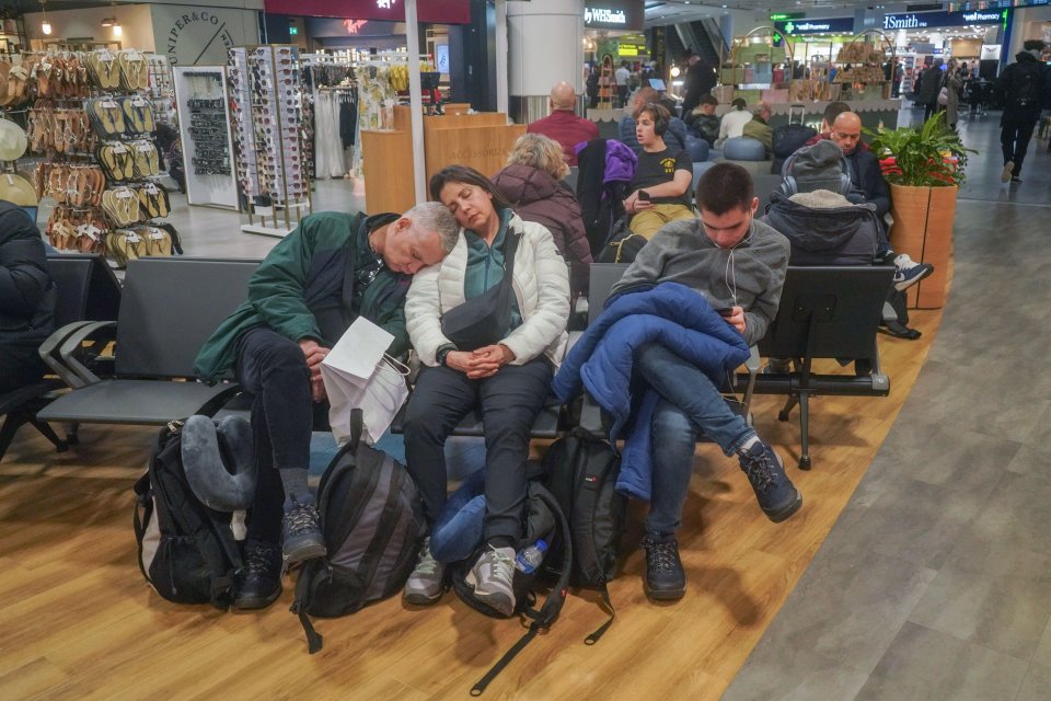 Passengers waiting at the departure lounge at Gatwick airport