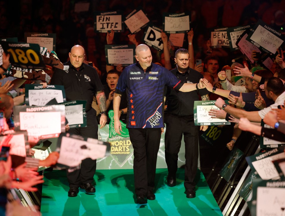 Raymond van Barneveld walking onto the stage at the PDC World Darts Championship.