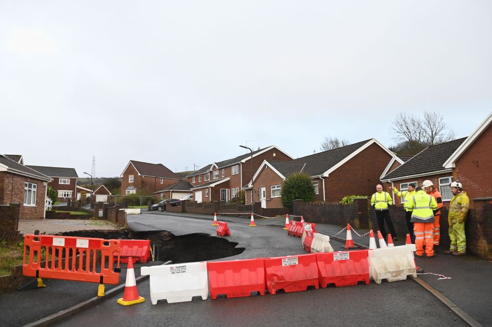 Crews at the site of the sinkhole