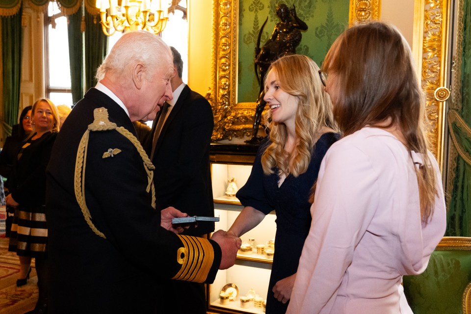 King Charles presents an Elizabeth Emblem to Alicia Harper for Police Constable Andrew Harper, who died in the line of duty