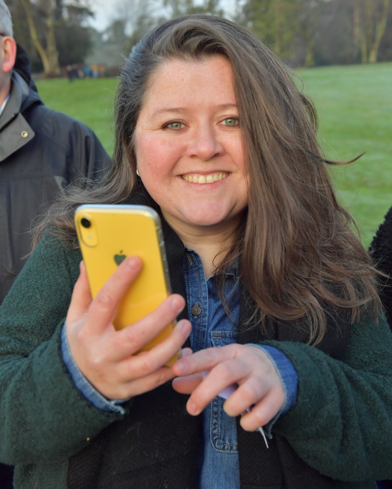 Woman using a yellow smartphone.