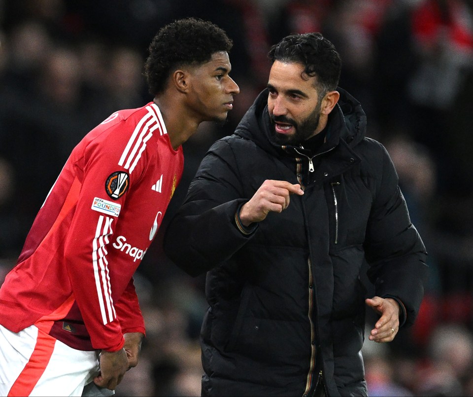 Ruben Amorim, Manchester United's head coach, speaks to Marcus Rashford.