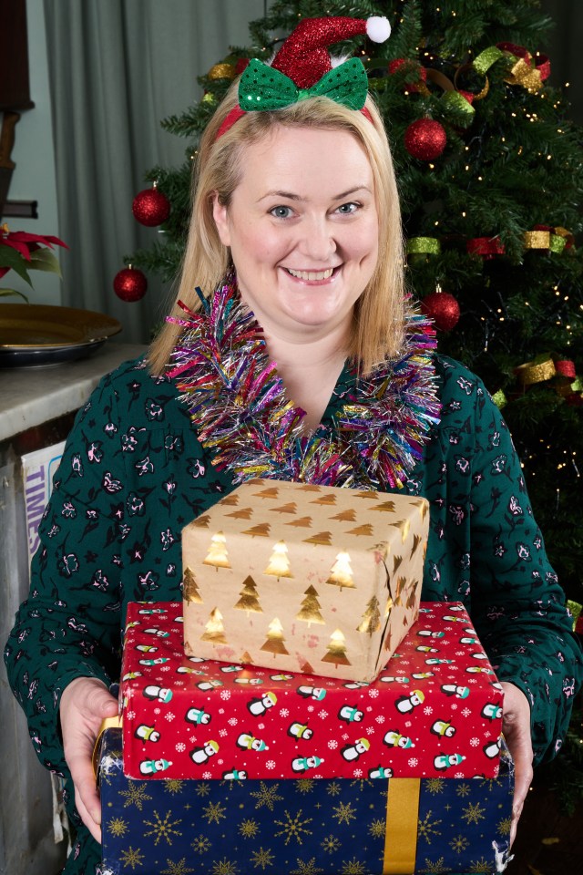 Woman holding Christmas presents.