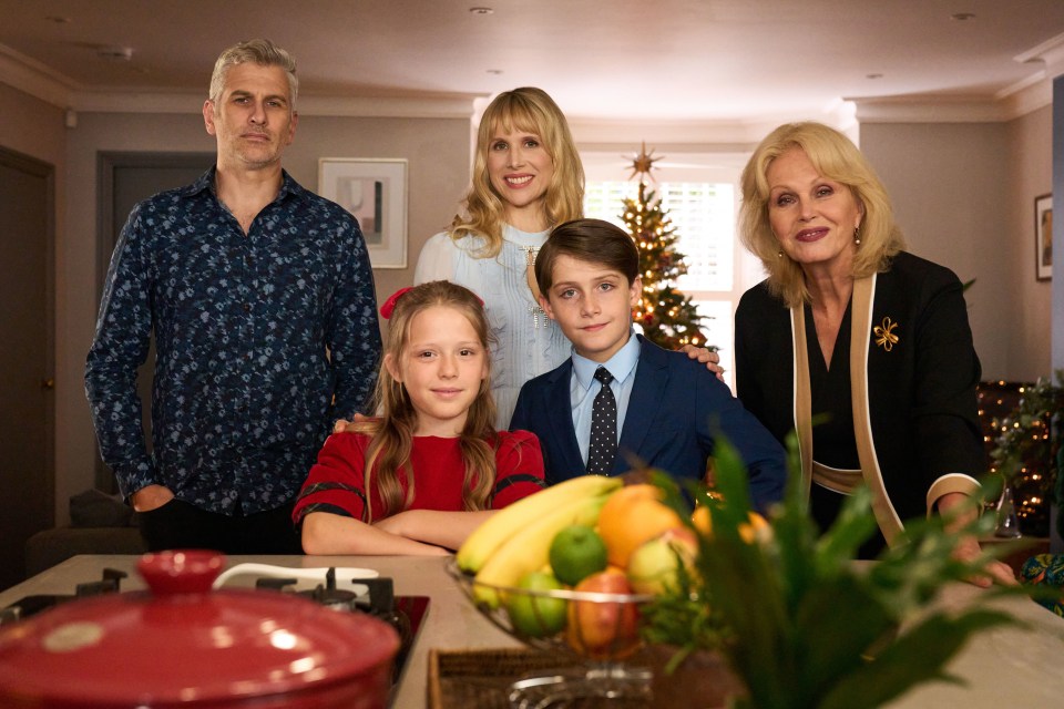 Family posing for a Christmas photo.