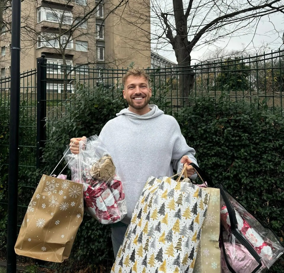 Sam Thompson carrying Christmas gifts.