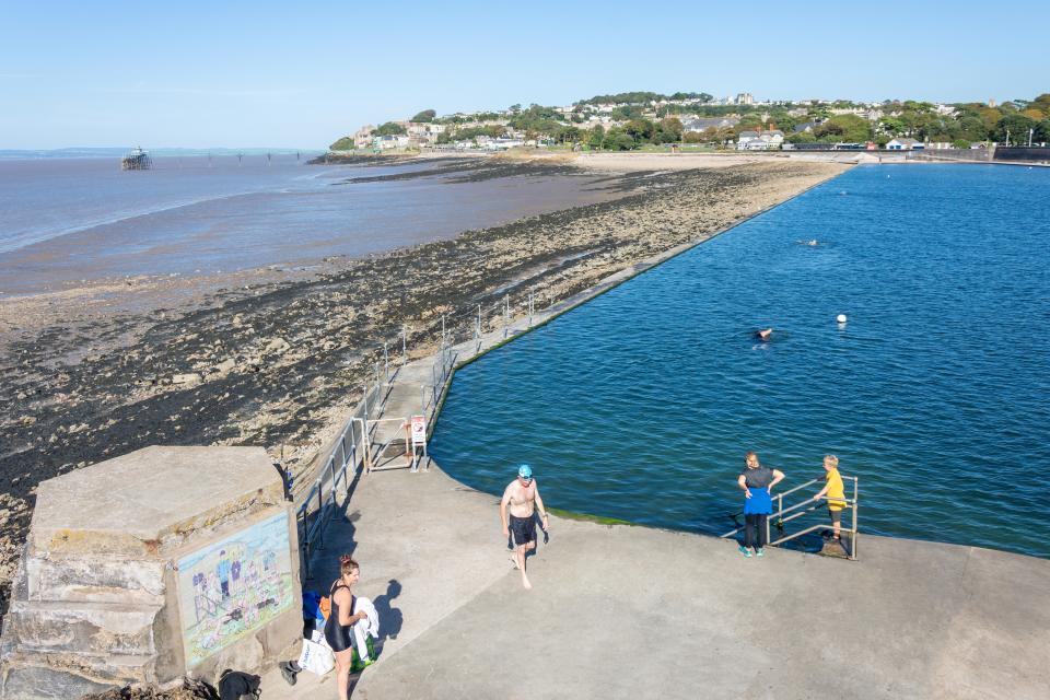 Swimmers at Marine Lake Lido in Clevedon, Somerset.