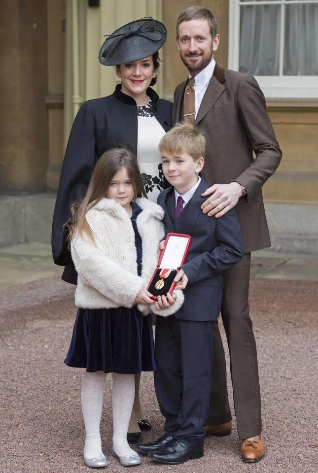 Sir Bradley Wiggins receives a knighthood at Buckingham Palace with his family.