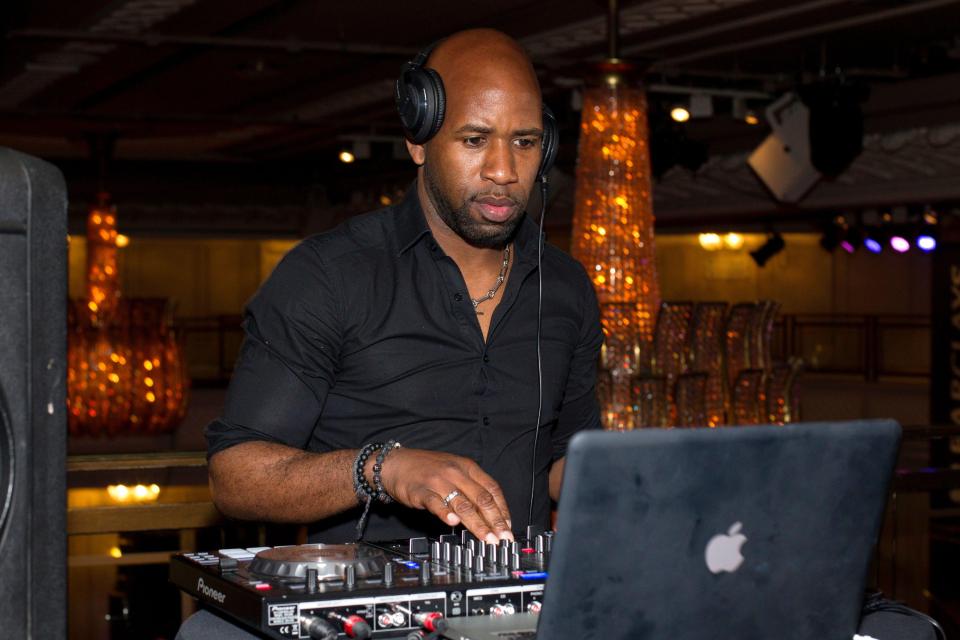 DJ Spoony performing at an awards dinner.