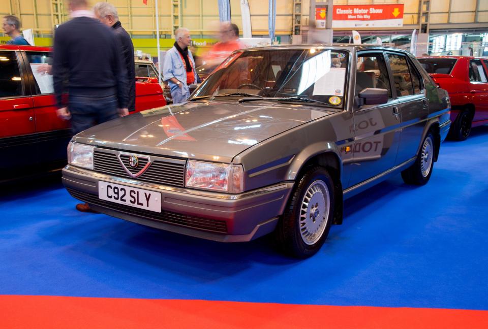 Gray Alfa Romeo 90 at a classic car show.