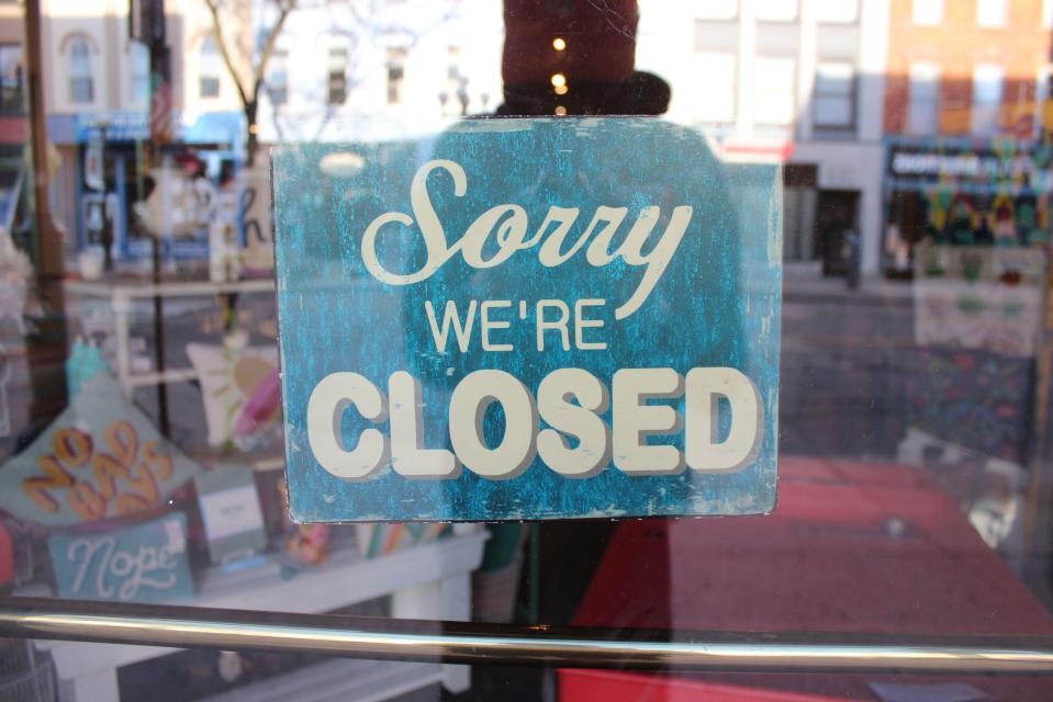 Closed sign in a shop window.